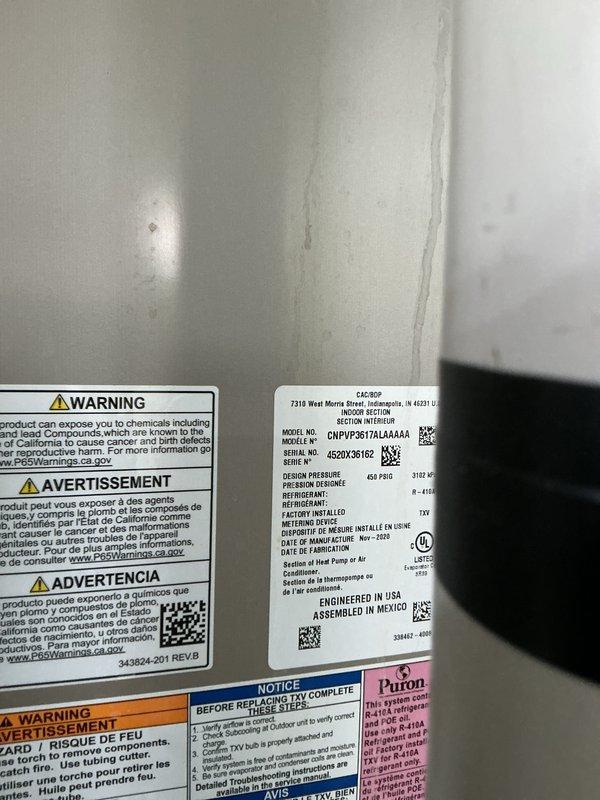 Completed scheduled cooling maintenance on Bryant HVAC system as rescheduled from previous appointment. Performed comprehensive cooling check (CCC) and Basic Plus maintenance service, inspecting condenser unit exterior, verifying Puron refrigerant specifications, and confirming system operational status. Thermostat displayed proper cooling mode operation with room temperature at 70°F, and all warning labels and manufacturer specifications were documented for service records.