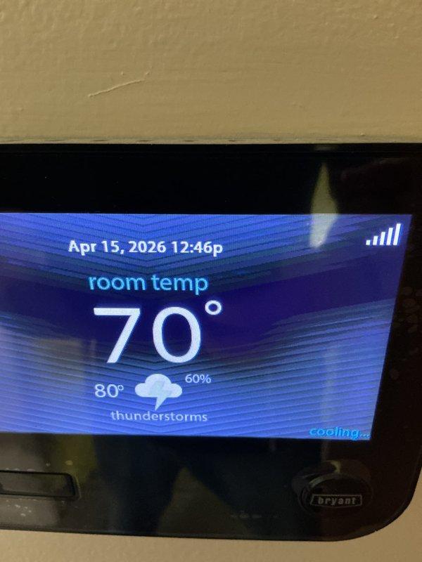 Completed scheduled cooling maintenance on Bryant HVAC system as rescheduled from previous appointment. Performed comprehensive cooling check (CCC) and Basic Plus maintenance service, inspecting condenser unit exterior, verifying Puron refrigerant specifications, and confirming system operational status. Thermostat displayed proper cooling mode operation with room temperature at 70°F, and all warning labels and manufacturer specifications were documented for service records.
