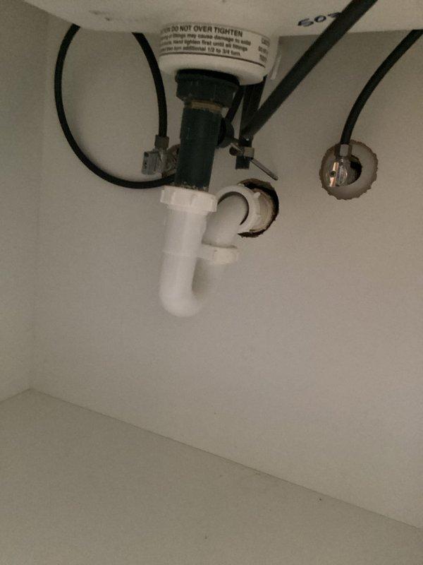 Completed monthly plumbing membership inspection of residential bathroom and water heater systems. Verified proper operation of chrome two-handle faucet with adequate water flow and drainage, inspected sink basin and drain assembly for leaks or damage, and examined water heater installation including pressure relief valve, flexible supply lines, and drainage components. All fixtures found to be functioning properly with no immediate concerns identified, and photographic documentation captured for service records.
