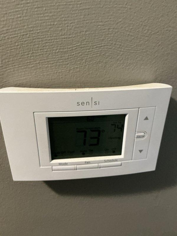 Completed routine spring maintenance visit on residential HVAC system including Lennox outdoor condensing unit and Sensi digital thermostat. Performed standard preventive maintenance procedures on both cooling and heating components, utilized diagnostic gauges to verify proper refrigerant pressures and system operation, and confirmed thermostat functionality with temperature reading at 73 degrees.