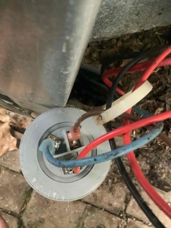 Responded to no cooling complaint on residential air conditioning system. Upon arrival, performed diagnostic evaluation of electrical components and control wiring. Inspected circuit breaker panel and verified proper power supply to outdoor condensing unit. Examined low-voltage control wiring connections at equipment terminal block, identifying loose or compromised wire connections affecting system operation. Secured all electrical connections at terminal points, ensuring proper contact and continuity. Tested system operation following repairs, confirmed unit cycling properly with compressor and condenser fan engaging as designed. System restored to normal cooling operation.