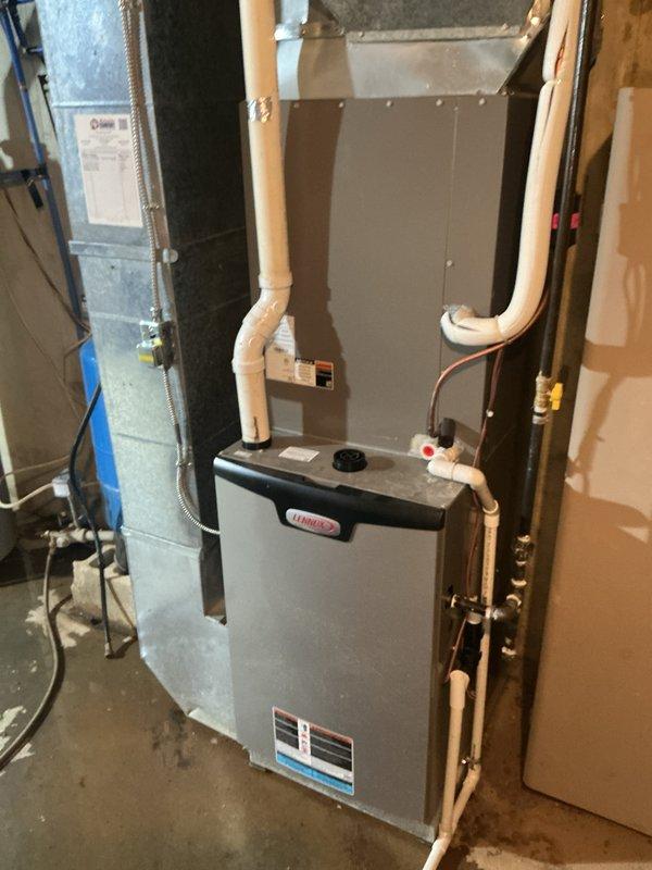 Completed routine preventative maintenance on residential Lennox HVAC system. Performed comprehensive inspection of furnace unit, ductwork plenum, and condensate drainage system. Verified proper operation of air conditioning components including outdoor condenser unit electrical system, capacitor functionality (45/5 MFD), and refrigerant line connections. Inspected copper refrigerant lines and brass fittings for leaks and proper insulation. Checked all electrical connections, wire bundles, and terminal blocks for secure mounting and proper voltage. Cleaned and tested capacitor, verified wiring integrity including ground connections. System operating within normal parameters with no deficiencies noted.