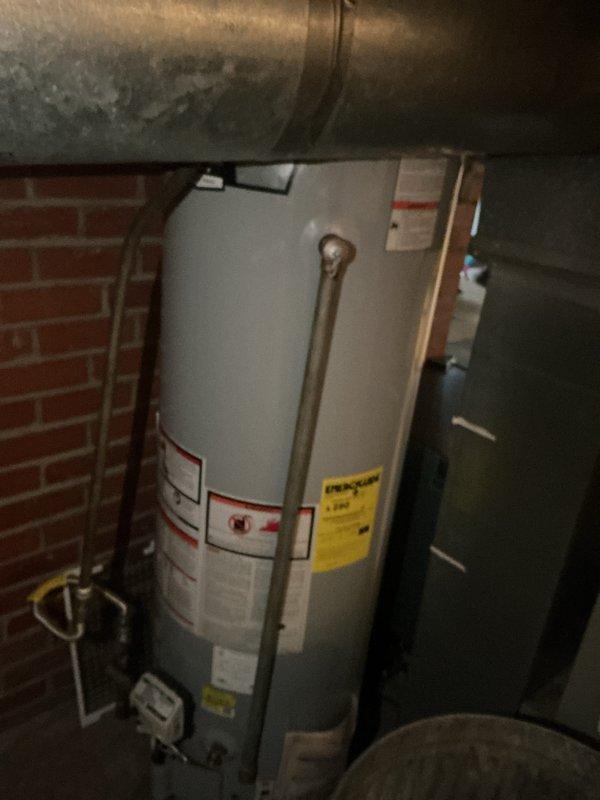 Completed comprehensive HVAC maintenance inspection of residential heating and cooling system located in basement utility area. Performed visual inspection of refrigerant lines, ductwork, and associated mechanical components, verifying proper insulation and connections on refrigerant piping marked with identification tag 16-25-1. Documented system condition through photographic records showing galvanized ductwork, plumbing infrastructure, and mechanical room layout for maintenance history files.