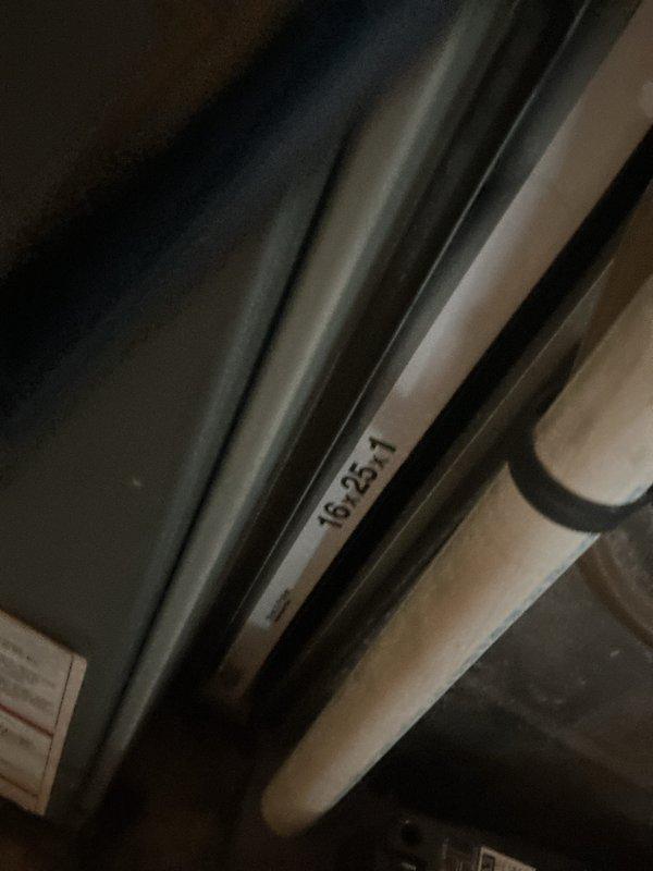 Completed comprehensive HVAC maintenance inspection of residential heating and cooling system located in basement utility area. Performed visual inspection of refrigerant lines, ductwork, and associated mechanical components, verifying proper insulation and connections on refrigerant piping marked with identification tag 16-25-1. Documented system condition through photographic records showing galvanized ductwork, plumbing infrastructure, and mechanical room layout for maintenance history files.