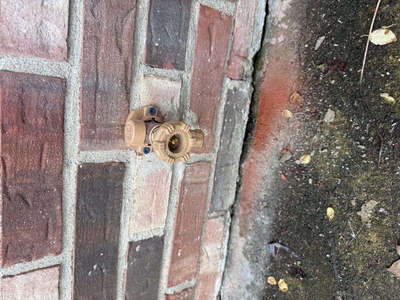 Replaced exterior brass hose bib mounted on brick wall with new frost-free spigot, ensuring proper installation and secure mounting. Removed approximately 10 feet of flexible yellow gas line from interior crawl space, disconnecting and capping gas connection points in accordance with safety protocols.