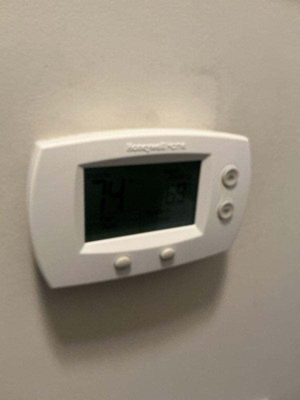 # HVAC Maintenance Report

Completed basic monthly cooling maintenance on residential air conditioning system. Performed comprehensive inspection of outdoor condensing unit located in exterior alcove area. Conducted operational testing and diagnostic measurements using digital gauges and monitoring equipment to verify system performance and refrigerant pressures.

Inspected indoor thermostat functionality and confirmed proper temperature control operation. Replaced standard 20x20x1 air filter as part of routine maintenance protocol. Evaluated condenser coil condition, fan operation, and electrical connections at outdoor unit. All components found operating within normal parameters with no immediate service concerns identified. System running efficiently and ready for continued cooling season operation.