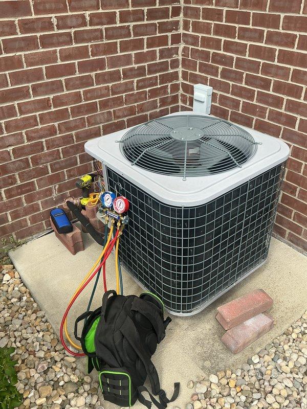 # HVAC Maintenance Report

Completed basic monthly cooling maintenance on residential air conditioning system. Performed comprehensive inspection of outdoor condensing unit located in exterior alcove area. Conducted operational testing and diagnostic measurements using digital gauges and monitoring equipment to verify system performance and refrigerant pressures.

Inspected indoor thermostat functionality and confirmed proper temperature control operation. Replaced standard 20x20x1 air filter as part of routine maintenance protocol. Evaluated condenser coil condition, fan operation, and electrical connections at outdoor unit. All components found operating within normal parameters with no immediate service concerns identified. System running efficiently and ready for continued cooling season operation.