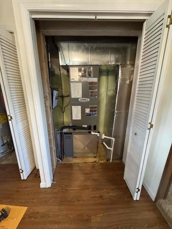 Completed full installation of Lennox heat pump system with integrated humidifier in residential mechanical closet. System includes air handler with proper ductwork connections, condensate management, and all electrical components tested and verified operational using diagnostic equipment. All manufacturer specifications confirmed, equipment secured and labeled appropriately, with system commissioned and ready for service.