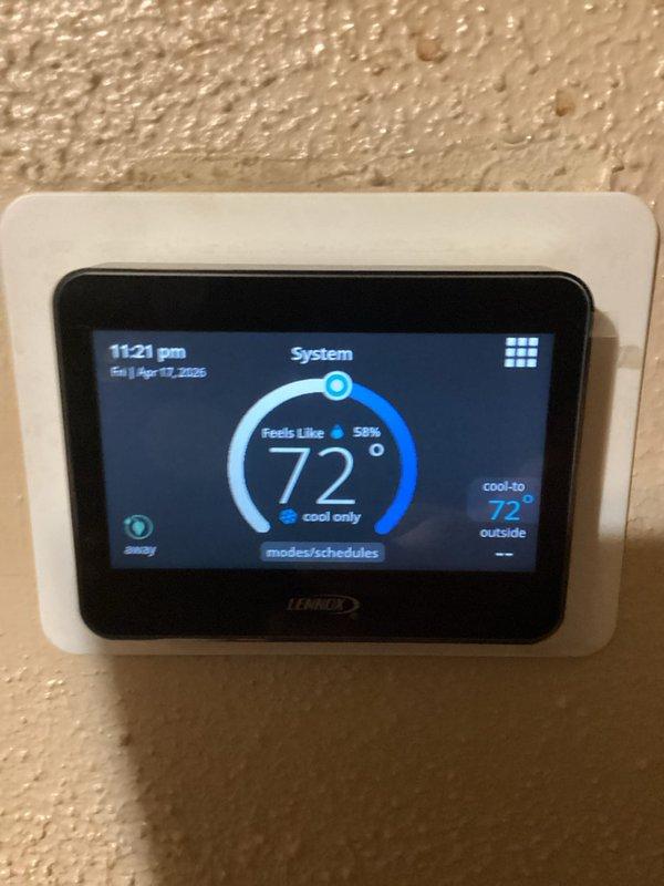 # HVAC Service Call - No Cooling Issue

Responded to a no cooling complaint on a Lennox system. Upon arrival, verified thermostat was set to cooling mode and calling for 72°F. Thermostat display showed system in cooling mode with outdoor temperature reading visible. Proceeded to outdoor unit to diagnose cooling failure.

Inspected condensing unit and found compressor not operating. Checked electrical connections and verified power supply to unit. Tested capacitor and found it failed, preventing compressor from starting. Replaced defective run capacitor with proper OEM replacement rated for system specifications.

Cycled system through multiple cooling cycles to verify proper operation. Confirmed compressor engaged successfully, refrigerant pressures within normal operating range, and adequate airflow across condenser coil. System cooling effectively and maintaining setpoint temperature. Left system operational with customer satisfied.