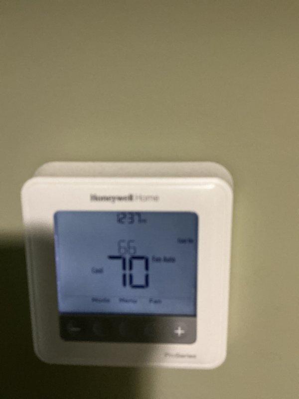 Completed routine HVAC maintenance including replacement of 16x21x1 air filter per CCHBasic Monthly service agreement. Inspected heating system components, verified thermostat operation showing proper temperature control at 70°F setpoint, and documented water heater condition with all safety labels intact and legible.