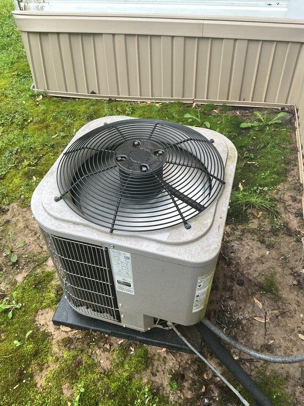 Completed cooling maintenance on residential air conditioning system with expired service agreement. Performed standard inspection of outdoor condenser unit and indoor thermostat controls, documented equipment condition with photos showing Emerson thermostat and exterior condensing unit in operational status. Unable to verify air filter status during this service visit.