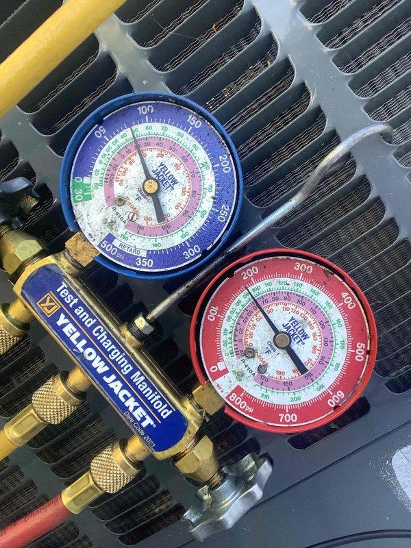 Responded to no cooling complaint and found evaporator coil freezing up. Performed diagnostic testing using manifold gauges and multimeter to assess system pressures and electrical parameters. Identified airflow restriction causing coil icing condition, likely due to restricted airflow across evaporator coil, and provided recommendations for resolving the freeze-up issue to restore proper cooling operation.