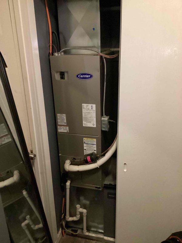 Completed basic monthly cooling maintenance on Carrier HVAC system. Performed inspection of indoor air handler unit located in utility closet and outdoor condenser unit positioned on concrete pad against exterior brick wall. Verified operation of all components, checked refrigerant lines, inspected condensate drain system with PVC piping, and confirmed proper electrical connections at disconnect box. System operating within normal parameters with no issues identified during routine maintenance visit.