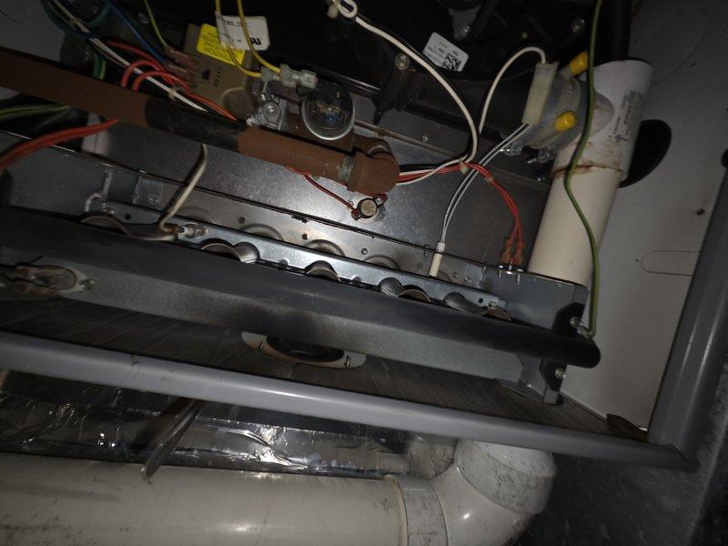 # HVAC Service Report

Responded to no cooling complaint on residential HVAC system. Upon arrival, inspected unit and found furnace control board and gas valve assembly with proper electrical connections intact. However, discovered severe water damage and microbial growth throughout the mechanical compartment, affecting drain pan and surrounding cabinet interior. The extensive moisture intrusion and deteriorated conditions indicated long-term drainage issues that compromised system integrity. Documented existing damage with photos for customer records. Advised customer of unsafe operating conditions and recommended immediate system replacement due to extent of water damage, potential mold contamination, and structural compromise of unit cabinet.