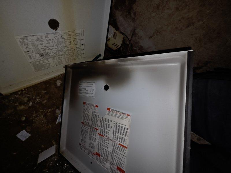 # HVAC Service Report

Responded to no cooling complaint on residential HVAC system. Upon arrival, inspected unit and found furnace control board and gas valve assembly with proper electrical connections intact. However, discovered severe water damage and microbial growth throughout the mechanical compartment, affecting drain pan and surrounding cabinet interior. The extensive moisture intrusion and deteriorated conditions indicated long-term drainage issues that compromised system integrity. Documented existing damage with photos for customer records. Advised customer of unsafe operating conditions and recommended immediate system replacement due to extent of water damage, potential mold contamination, and structural compromise of unit cabinet.