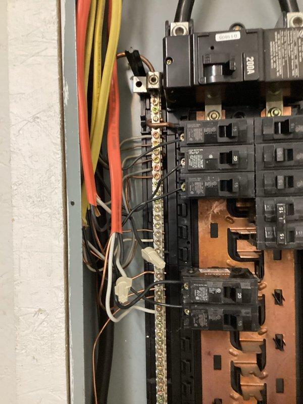 Installed dedicated electrical circuits for a ceiling fan and air compressor in an unfinished space. Ran new wiring from the main electrical panel to the designated locations, mounting a blue outlet box at the ceiling/wall junction for the air compressor circuit. Added appropriate circuit breakers to the panel and made all necessary connections to the bus bars using proper gauge conductors. Installed mounting hardware and electrical box for the ceiling fan location. All work completed to code specifications with secure wire terminations and proper circuit protection.