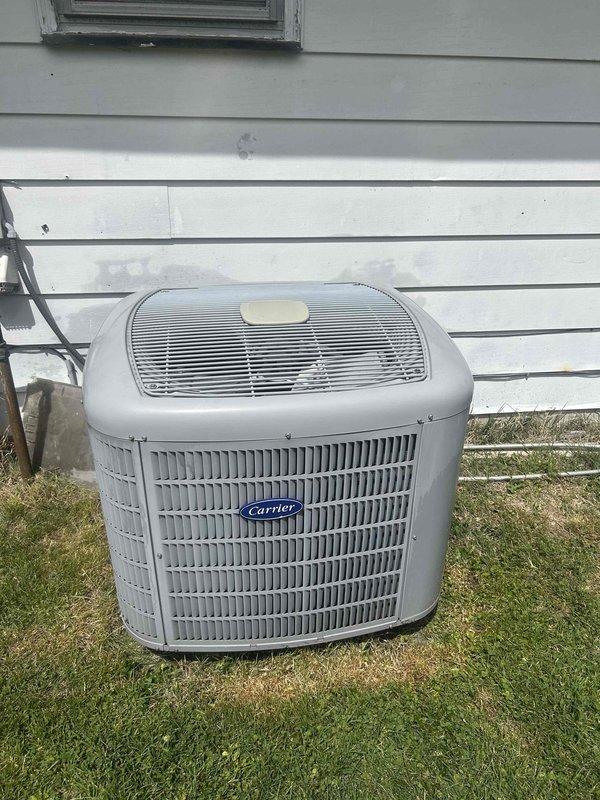 Completed basic monthly cooling maintenance visit on Carrier air conditioning system. Inspected outdoor condenser unit and verified operational status, checked thermostat programming and settings showing 72°F setpoint with system in scheduled mode. Customer requested water heater draining service for future scheduling; noted that 16x25x4 filter is not included in basic monthly service plan.