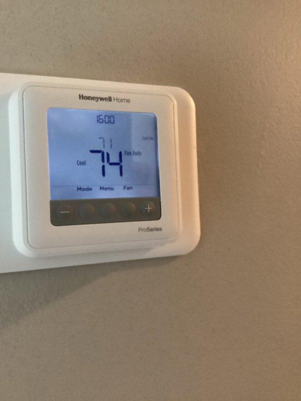 Completed basic monthly cooling maintenance on Lennox residential air conditioning system. Performed standard inspection of outdoor condenser unit, verified proper operation of Honeywell Home ProSeries thermostat displaying 74°F in cooling mode, and confirmed system functionality. All components operating within normal parameters at time of service.