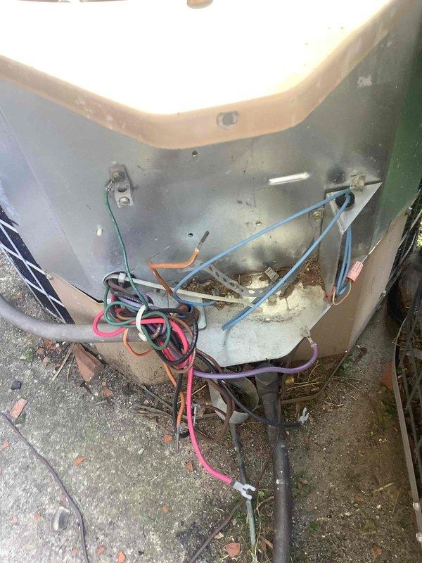 Responded to no-cooling complaint on commercial HVAC system with suspected fan motor failure. Upon inspection, accessed indoor unit and found evaporator coil with moderate dust accumulation and examined outdoor unit electrical compartment revealing disorganized wiring connections with visible wear and debris accumulation. Documented equipment condition showing signs of age and lack of maintenance, including dirty coil surfaces and loose electrical connections requiring attention to restore proper system operation.