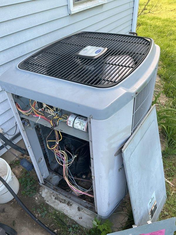 Performed comprehensive tune-up and inspection on residential split-system air conditioning unit. Accessed internal components, verified electrical connections and capacitor operation, and confirmed proper system function. Cleaned condenser unit and checked refrigerant lines for proper operation.