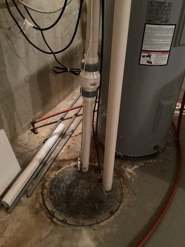 Completed monthly plumbing inspection for membership service. Inspected and photographed bathroom fixtures including sink faucet, drain assembly, and supply lines, confirming proper operation with no visible leaks. Examined basement utility area including sump pump system, water heater, and associated PVC drainage piping, verifying all components functioning within normal parameters.