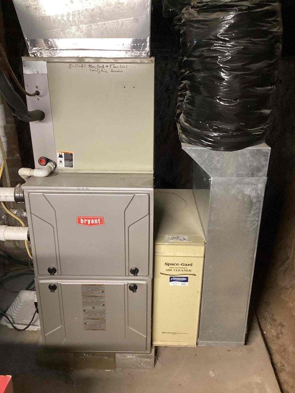 Completed comprehensive AC clean and check on Bryant furnace system with integrated Space-Gard air cleaner. Inspected all system components, verified proper operation of furnace unit and air handler, checked PVC condensate drainage connections, and confirmed air filtration system functionality with clean KOCH filter installed.
