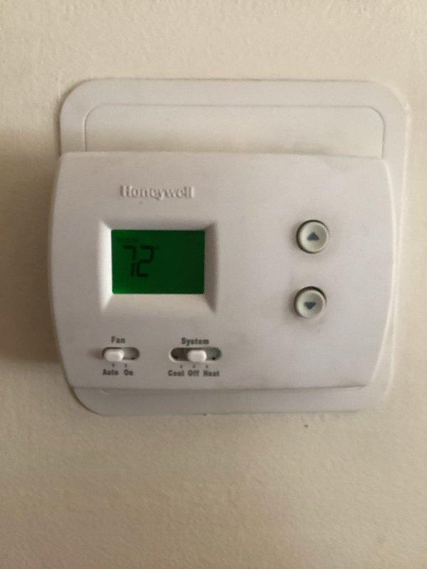 Responded to callback for burnt rubber odor during heating operation and air conditioning failure to start. Inspected Trane XR80 furnace system and verified thermostat operation set at 75°F. Conducted thorough examination of furnace cabinet, blower assembly, and electrical components to identify source of odor and AC malfunction. Documented equipment condition with photos showing proper installation and current system configuration for service records.