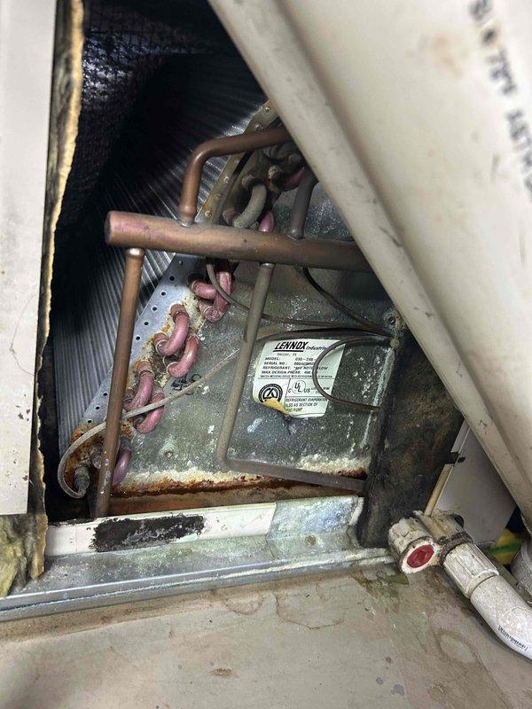 Completed cooling season maintenance on residential HVAC system as part of basic monthly maintenance agreement. Performed comprehensive inspection of blower assembly, electrical connections, and refrigerant lines, noting moderate dust accumulation on return air grille and evidence of aging components with surface oxidation on copper tubing and rust formation on equipment housing. Documented system condition with photographs showing blower motor compartment, wiring harness, and return vent requiring cleaning during next service interval to maintain optimal airflow and system efficiency.