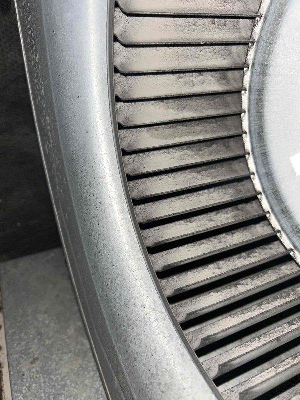 Completed cooling season maintenance on residential HVAC system as part of basic monthly maintenance agreement. Performed comprehensive inspection of blower assembly, electrical connections, and refrigerant lines, noting moderate dust accumulation on return air grille and evidence of aging components with surface oxidation on copper tubing and rust formation on equipment housing. Documented system condition with photographs showing blower motor compartment, wiring harness, and return vent requiring cleaning during next service interval to maintain optimal airflow and system efficiency.