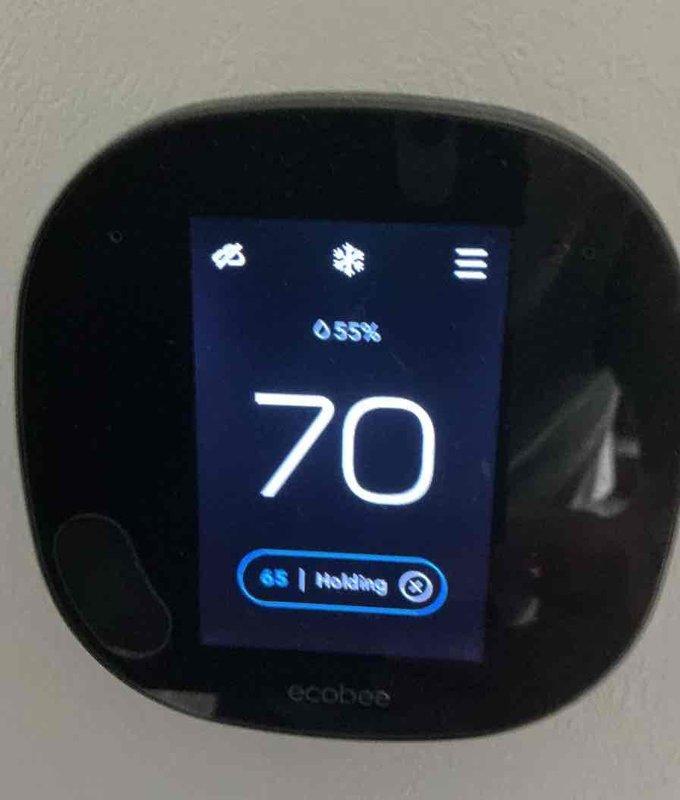 Completed basic monthly cooling maintenance on residential HVAC system. Performed standard inspection of outdoor condenser unit, verified proper operation of ecobee thermostat displaying 70°F setpoint with 55% humidity reading in hold mode, and confirmed system functionality. All equipment operating within normal parameters at time of service.