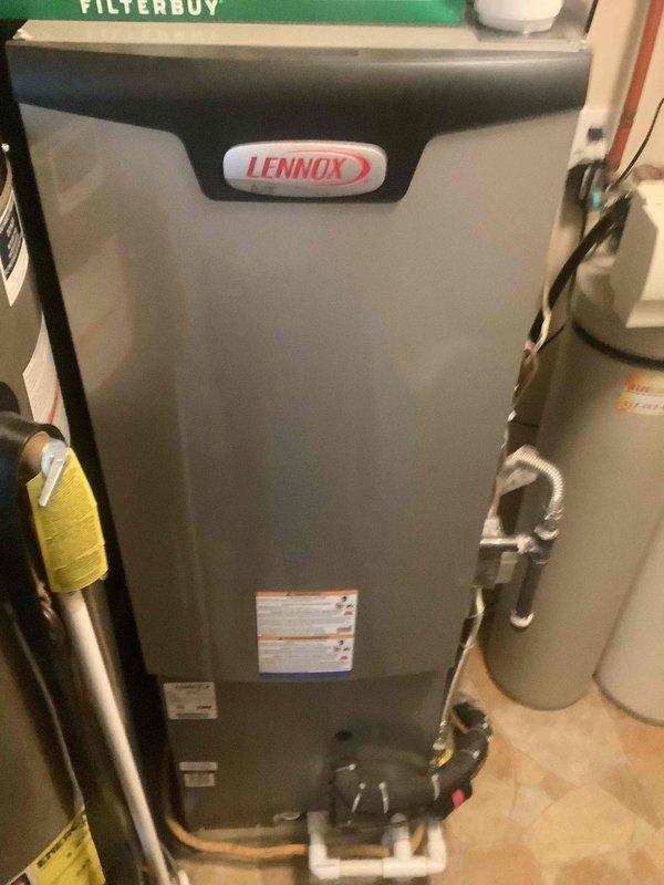 Completed preventive maintenance tune-up on residential Lennox split system HVAC unit. Inspected indoor air handler with refrigerant lines and condensate drain system, verified proper operation and filter condition. Serviced outdoor condensing unit, checked electrical connections, refrigerant lines, and confirmed system performance within manufacturer specifications.