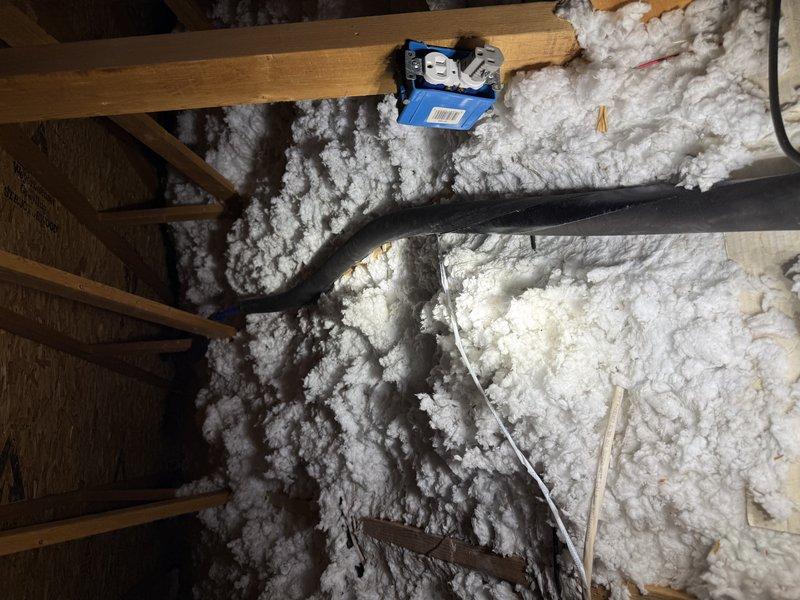 Installed new water main line to replace aging infrastructure. Routed supply piping through attic space, securing black foam pipe insulation around exposed copper lines to prevent heat loss and condensation. Verified proper water pressure and flow throughout the system upon completion, with all connections tested for leaks and integrity.