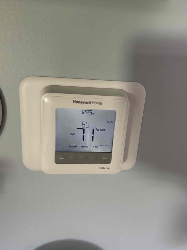 Completed basic monthly cooling maintenance on residential CCHP system. Performed standard inspection of outdoor condenser unit, verified proper operation and airflow through coil louvers, and confirmed thermostat functionality with Honeywell ProSeries digital control set to cooling mode. System operating within normal parameters at time of service.