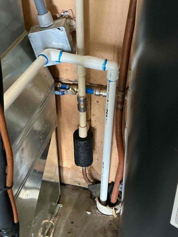 Responded to water heater leak discovered during routine HVAC maintenance. Upon inspection, confirmed active leak from tanked water heater requiring immediate attention. Replaced failed water heater unit and installed new plumbing configuration including PVC supply lines with gate valves for isolation capability, proper condensate pan for leak protection, and black foam pipe insulation on vertical sections to prevent condensation and heat loss. Ensured all connections were secure with compression fittings and verified proper drainage. System tested and confirmed operational with no leaks detected.