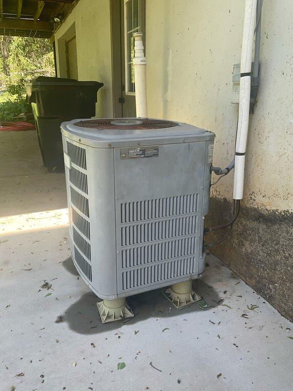 Conducted on-site assessment for complete HVAC system replacement estimate at residential property. Evaluated existing outdoor cylindrical condenser unit positioned on concrete patio under covered area, noting weathered condition and standard installation on plastic support pads with PVC condensate line and electrical disconnect present. Inspected indoor electrical connections and utility area, observing significant dust and debris accumulation around outlet panels and evidence of inadequate filtration. Prepared dual equipment replacement proposals including conventional forced-air system options and geothermal heat pump alternatives to meet homeowner's request for comprehensive comparison of both heating and cooling technologies.