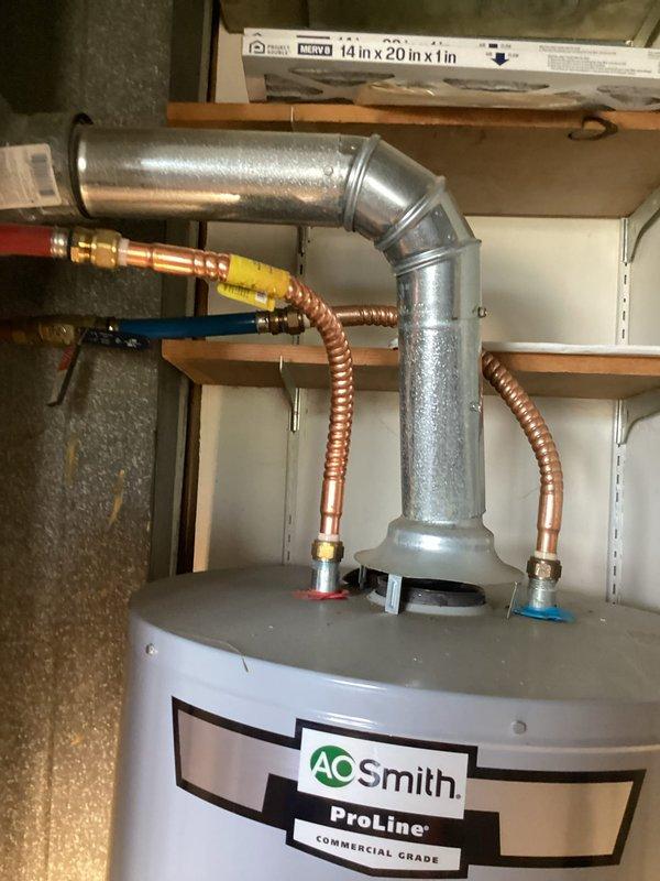 Completed prepaid plumbing maintenance inspection of residential water heating system. Thoroughly examined AO Smith ProLine Commercial Grade water heater installation, including all connections, safety components, and venting system. Inspected gas supply line, copper water supply lines with flexible corrugated sections, drain pan condition, and flue pipe assembly. Verified proper operation of temperature and pressure relief valve, gas control valve, and all warning labels for compliance. Documented system condition with photographs for maintenance records. Unit found to be in satisfactory operating condition with no immediate service needs identified.