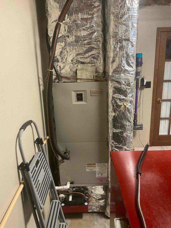Completed comprehensive estimate for HVAC system replacement, transitioning from existing wood/electric heating system to new two-stage gas furnace and air conditioning unit. Assessed mechanical room layout, existing ductwork configuration, and utility connections including gas line requirements, electrical service modifications, and proper venting pathways for new gas appliance installation. Documented current equipment placement, clearance requirements, and recommended installation specifications for dual-fuel system upgrade to improve heating efficiency and add central cooling capability.