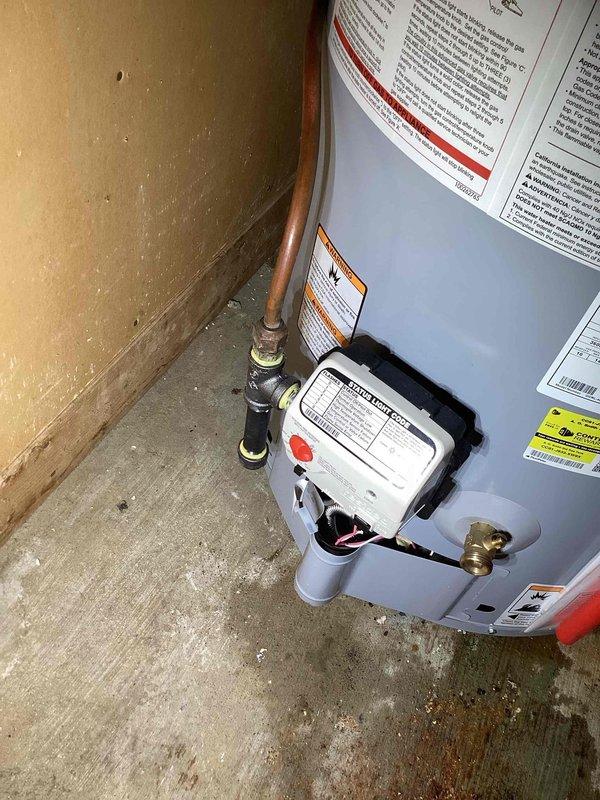 Returned to property to complete replacement of 40-gallon short propane water heater. Removed existing unit and installed new propane-fired water heater in corner location. Connected copper supply lines to top of tank using appropriate fittings and made all necessary gas line connections to control valve assembly. Installed required PVC venting with proper pitch and secured all connections. Verified proper operation of gas valve, pilot light ignition, and temperature controls. Tested all plumbing connections for leaks and confirmed unit is heating properly. Installation completed per manufacturer specifications and local plumbing codes.