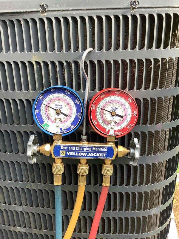Responded to no cooling complaint on residential air conditioning system. Upon arrival, connected Yellow Jacket manifold gauge set and digital multimeter to outdoor condensing unit to diagnose system performance. Performed refrigerant pressure testing and electrical diagnostics to identify cause of cooling failure. System evaluated and measurements documented for proper cooling restoration.