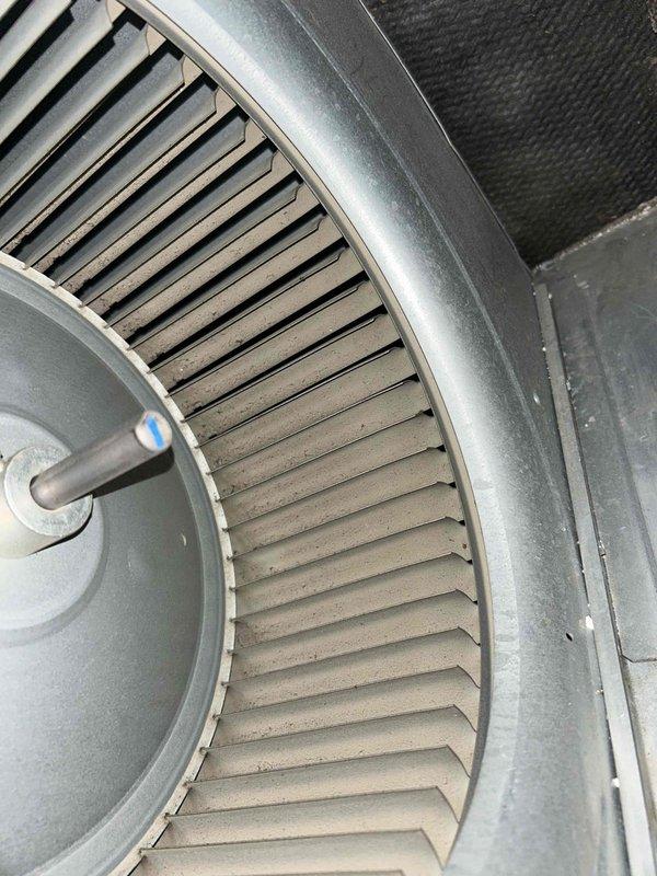 Responded to service call regarding heating system performance concerns. Upon inspection, found significant dust and debris accumulation on blower wheel assembly affecting airflow efficiency. Cleaned blower wheel and housing, verified proper operation of centrifugal fan assembly, and confirmed thermostat displaying accurate temperature readings with system cycling properly in cooling mode at time of service.