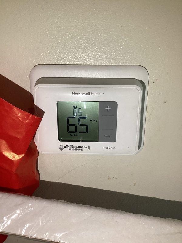 Completed comprehensive heating maintenance and inspection on residential HVAC system. Verified unit specifications and manufacturer data plate information, documenting model numbers, electrical specifications, and UL certification details. Confirmed thermostat operation with Honeywell Home Pro Series digital unit displaying proper heat mode functionality at 65°F setpoint. System operating within normal parameters at time of service completion.