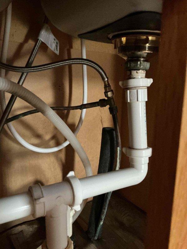 Responded to service call for copper pipe replacement and shut off valve installation under kitchen sink. Upon arrival, assessed the existing plumbing configuration beneath a stainless steel double-basin sink with modern pull-down sprayer faucet. Removed deteriorated copper supply line and installed new copper piping with proper connections to the existing water supply system. Installed new shut off valve under sink to provide convenient water control for future maintenance needs. Tested all connections for leaks, verified proper water flow and pressure to faucet, and confirmed shut off valve operates correctly. Left work area clean with all plumbing components functioning properly and no active leaks detected.