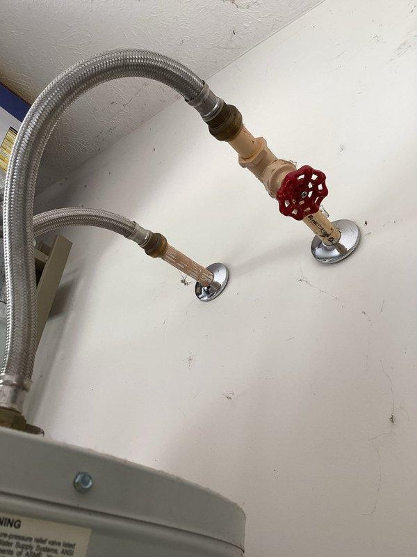 Responded to no-water service call and diagnosed inoperative A.O. Smith gas water heater in residential garage utility area. Upon inspection, determined water heater had failed and required replacement to restore hot water service to the residence. Documented existing installation configuration including gas line connections, water supply lines with shutoff valve, and exhaust venting adjacent to HVAC furnace unit for service records.