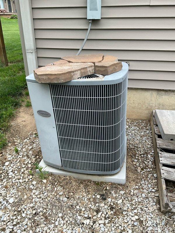 # HVAC Estimate - Replacement

Conducted comprehensive site evaluation for potential geothermal system replacement at residential property. Assessed existing outdoor condenser unit with improper weight placement on top surface and documented current Carrier furnace and air handler configuration in basement utility area. Photographed equipment conditions, electrical connections, refrigerant lines, and installation environment to provide detailed replacement estimate for complete HVAC system upgrade.