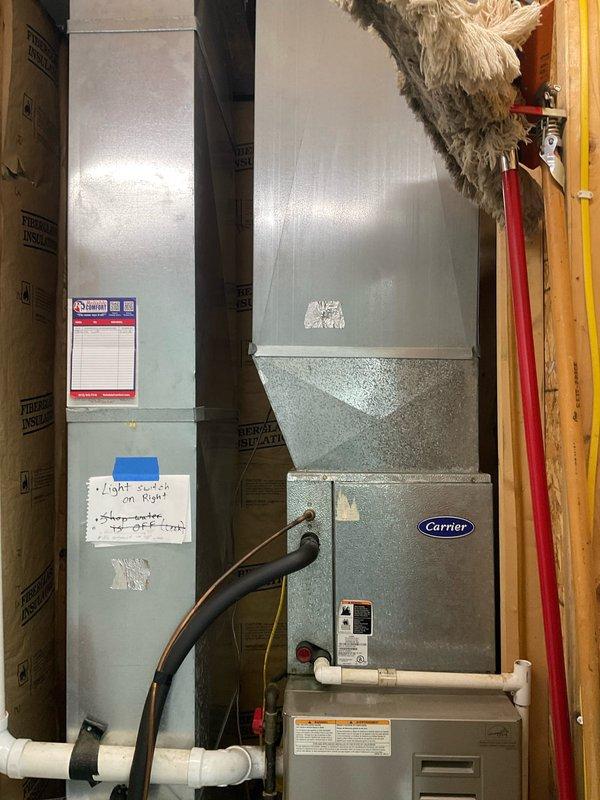# HVAC Estimate - Replacement

Conducted comprehensive site evaluation for potential geothermal system replacement at residential property. Assessed existing outdoor condenser unit with improper weight placement on top surface and documented current Carrier furnace and air handler configuration in basement utility area. Photographed equipment conditions, electrical connections, refrigerant lines, and installation environment to provide detailed replacement estimate for complete HVAC system upgrade.