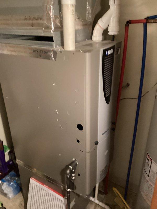 Completed basic monthly cooling maintenance on residential HVAC system. Inspected wall-mounted White-Rodgers thermostat confirming proper operation and display functionality, verified furnace/air handler unit and associated components in mechanical room, and documented equipment condition with photos. Filter size was unable to be determined during this visit.