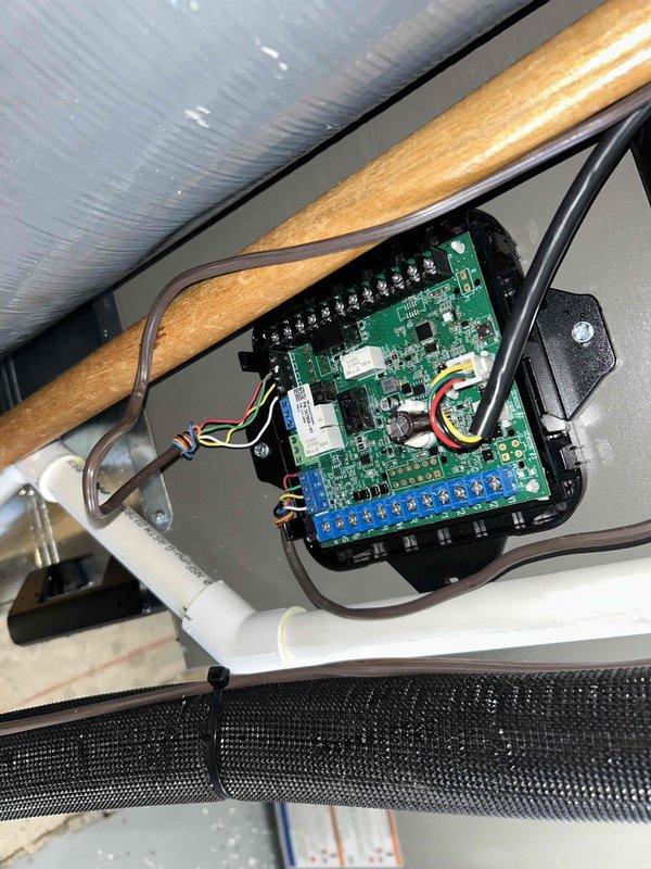 Responded to follow-up service call for Lennox HVAC system requiring technical support consultation. Inspected furnace unit and documented equipment specifications from manufacturer data plate, photographed electronic control board in attic space showing proper wire connections to terminal blocks, and verified system components prior to contacting technical support for troubleshooting guidance as noted by previous technician.