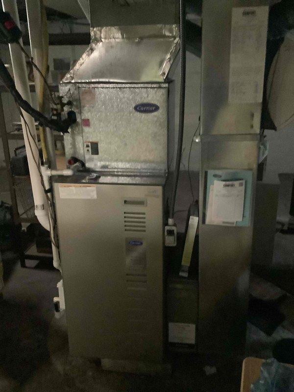 Completed basic monthly cooling maintenance on residential Carrier HVAC system located in basement utility area. Performed standard inspection of air handler unit and furnace assembly, checked refrigerant lines and ductwork connections, verified proper airflow through system components, and inspected condensate drainage. All equipment found operating within normal parameters with no issues identified requiring immediate attention.
