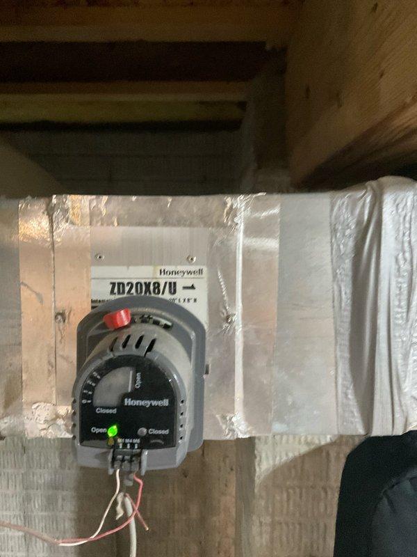 Conducted comprehensive estimate for complete HVAC system replacement at residential property, including new furnace and air conditioning unit installation. Evaluated existing attic-mounted equipment and ductwork configuration, documenting current system components including Honeywell motorized damper control unit (Model ZD20X8/U) with manual override capability and zone control devices with LED indicators. Assessed metallic ductwork with reflective foil-faced insulation, flexible ducting connections, and electrical wiring infrastructure to determine compatibility requirements for new equipment installation and identify any necessary modifications to existing air distribution network.
