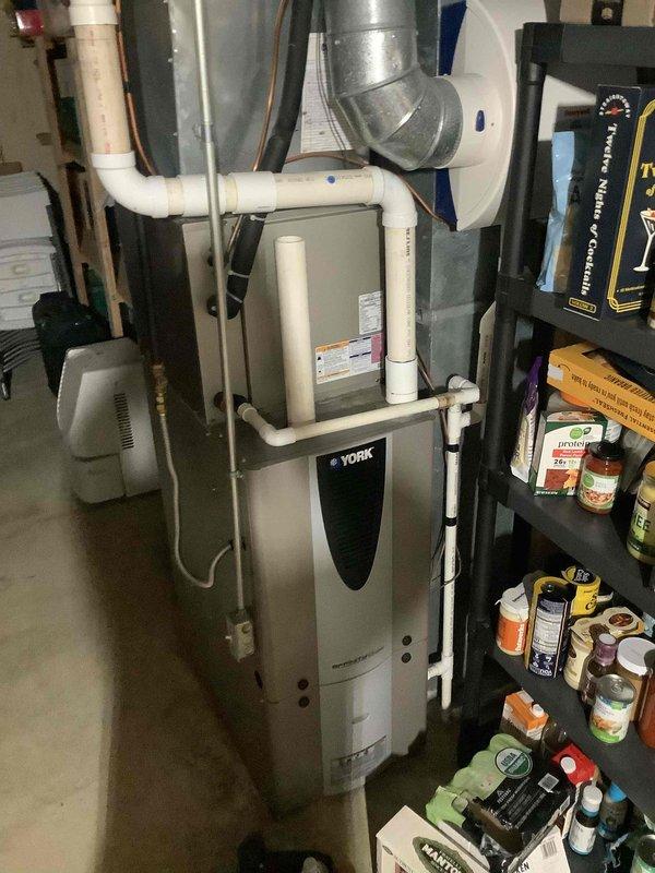 Completed basic monthly maintenance on York HVAC system including standard cooling season inspection. Replaced 16x25x1 air filter, verified ecobee smart thermostat operation showing 68°F setpoint with proper cooling cycle engagement, and inspected furnace unit with associated ductwork and PVC condensate drainage system for proper operation.